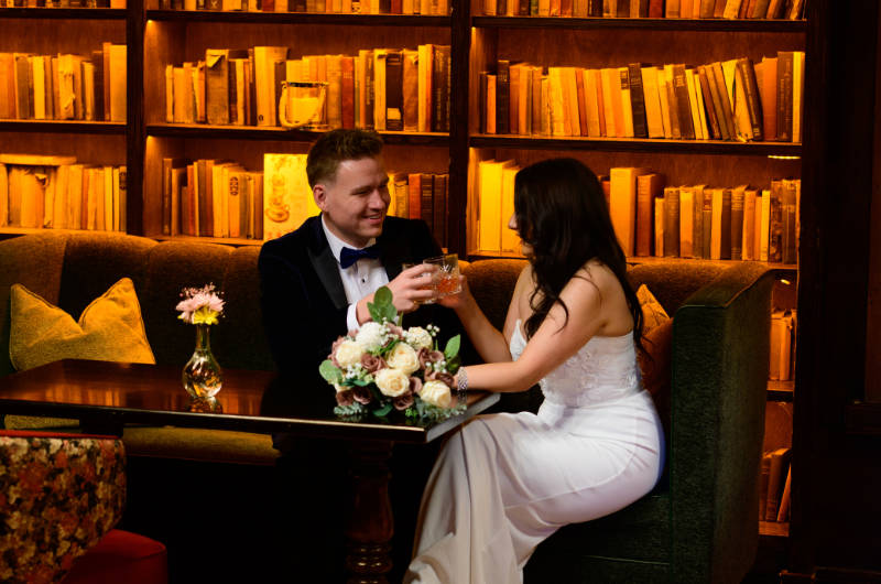 wedding couple toasting drinks