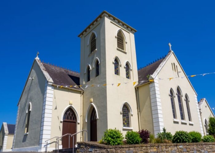 Cream Colored Church With Square Tower And Bunting iq4dcj