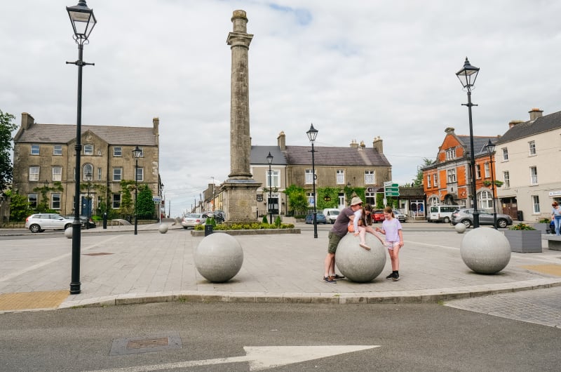 Family At Stone Spheres In Birr Town Square qtgrd2