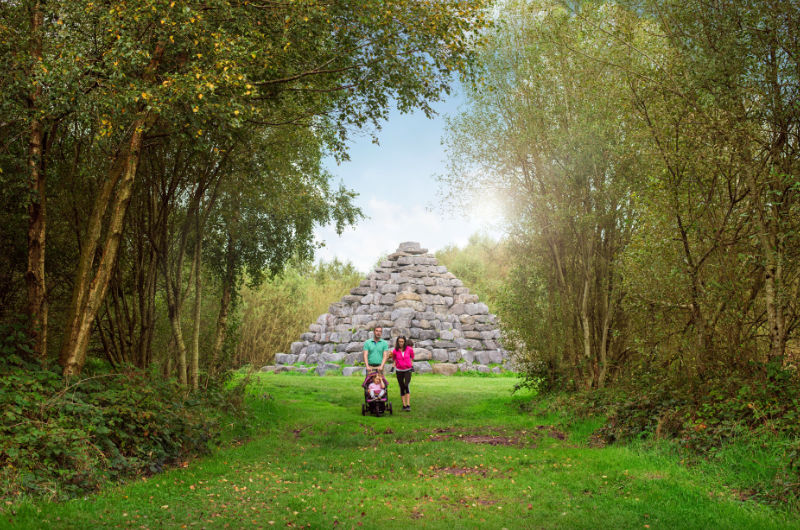 Family In Front Of Stone Pyramid