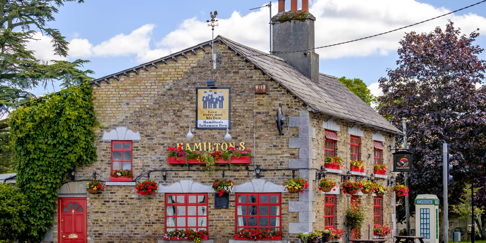 Geashill Header Image Traditional Irish Pub Hamiltons With Red Window Frames