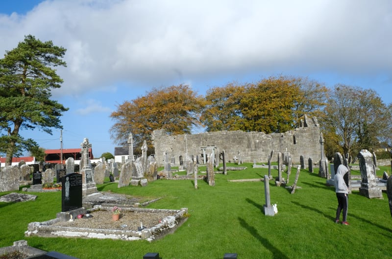 Graveyard with old stone church ruins and headstones cycedk