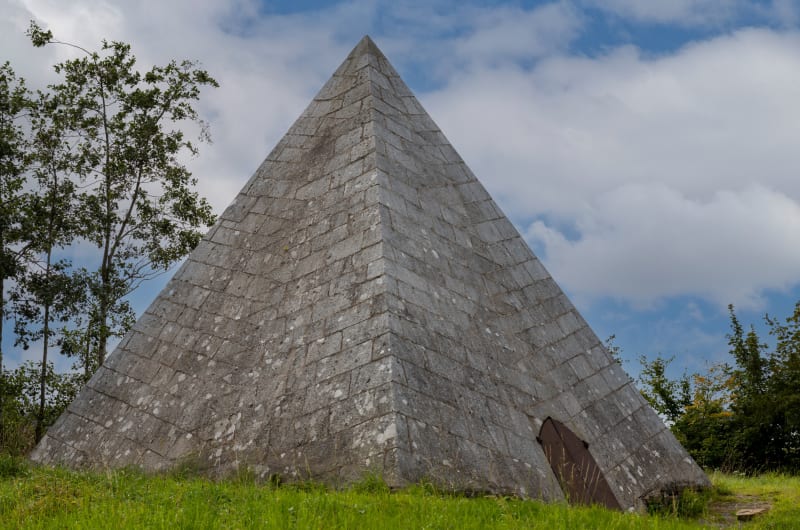 Grey Stone Pyramid Monument On Grassy Hill mpd0w7