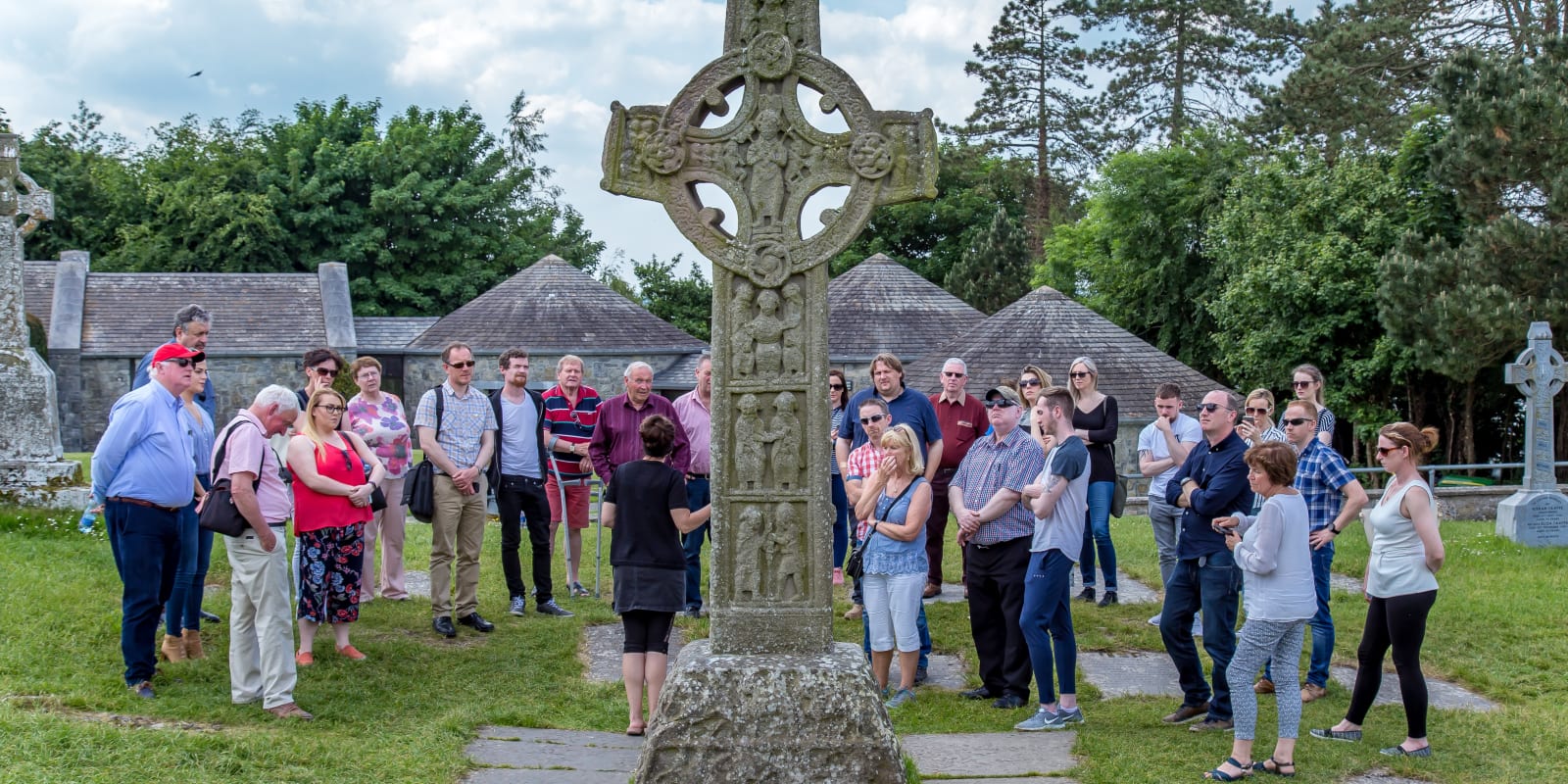 Group Of Tourists Looking At Celtic High Cross btwphl