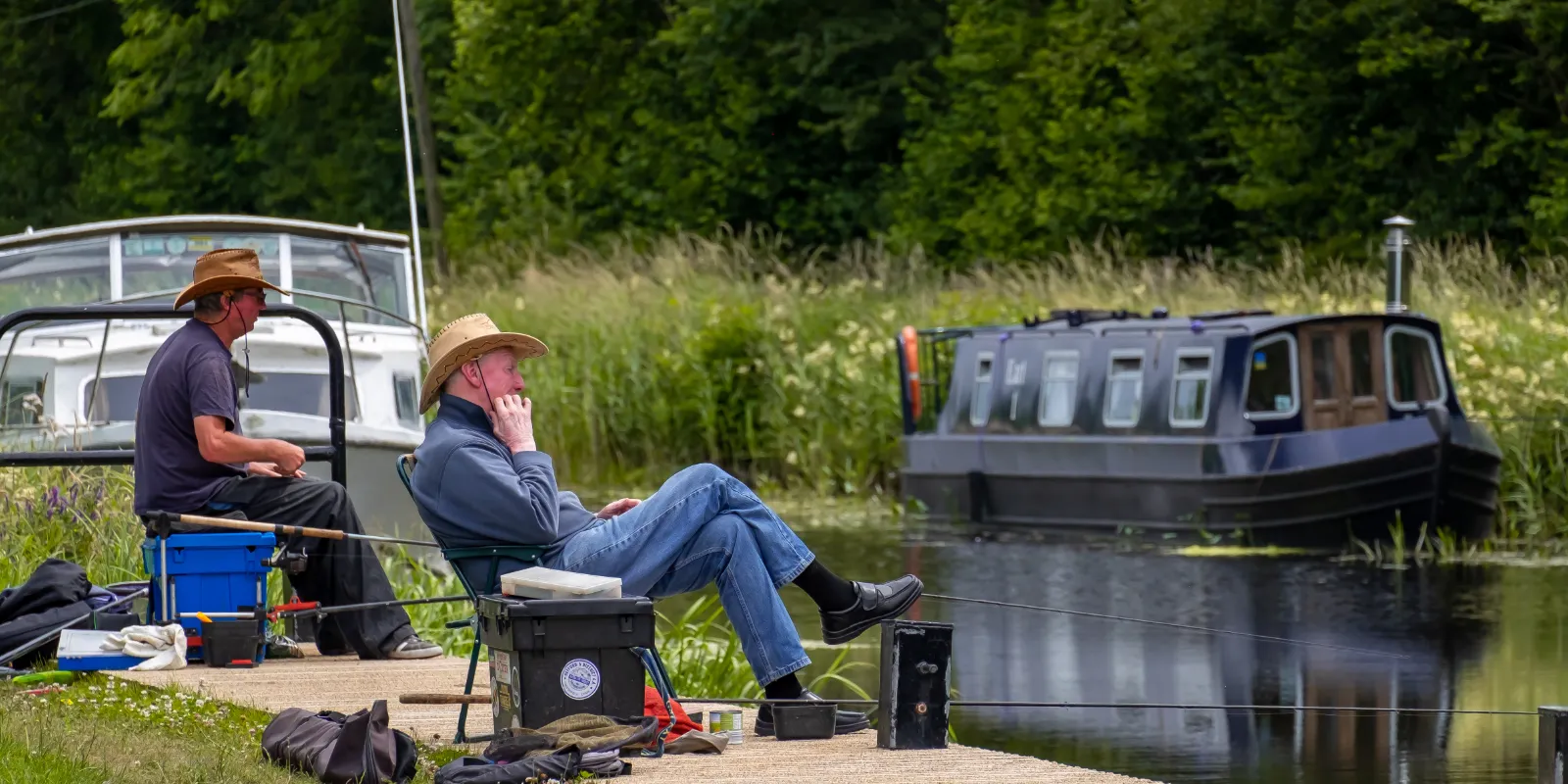 Header fishing on the grand canal two fishermen on bank boats