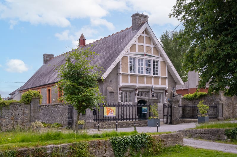 Historic Stone Building With Decorative White Gables urgh3j