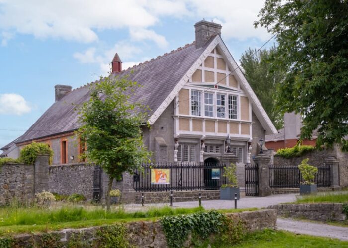 Historic Stone Building With Decorative White Gables urgh3j