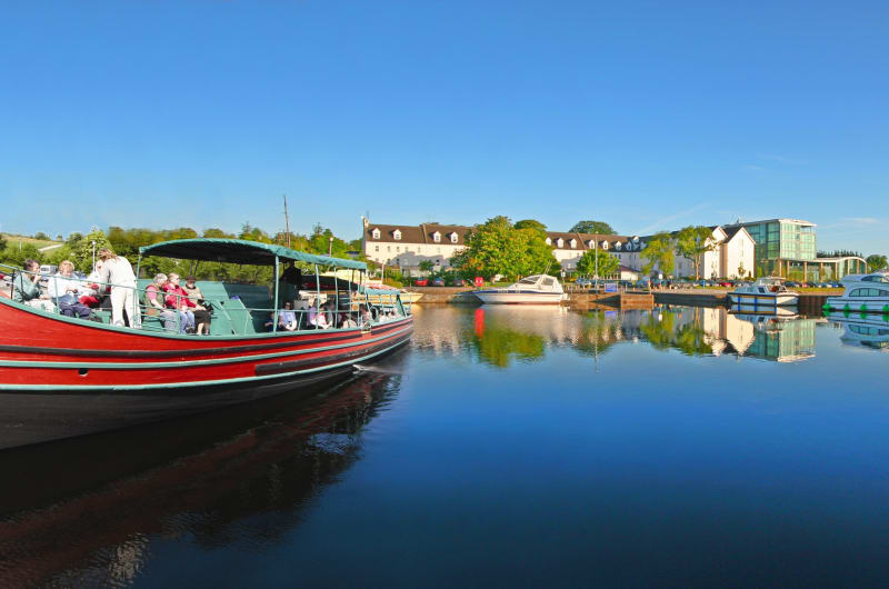 Large Red Viking Style Tour Boat With Passengers
