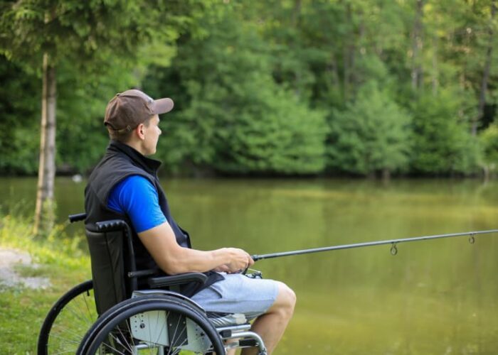 Man In Wheelchair Fishing By A Lake dyklgv