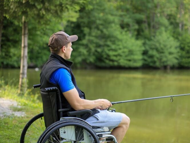 Man In Wheelchair Fishing By A Lake dyklgv