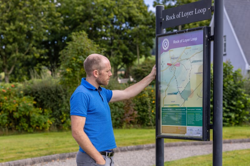 Man Viewing Rock Of Loyer Loop Trail Map jqaeaw