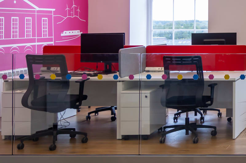 Modern Coworking Space With Desks And Colorful Walls