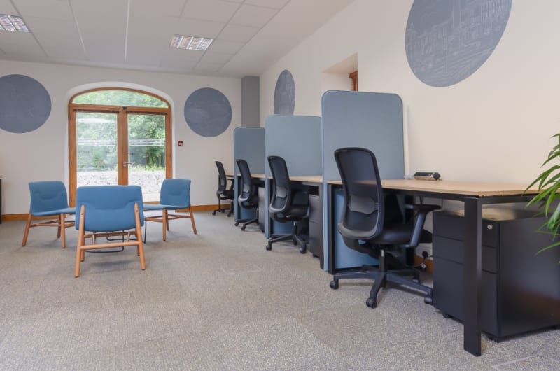 Modern Office Interior With Hotdesks And Blue Chairs