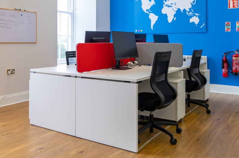 Modern Office Workspace With Desks And World Map