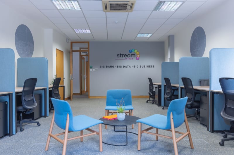 Modern coworking office interior with desks and chairs