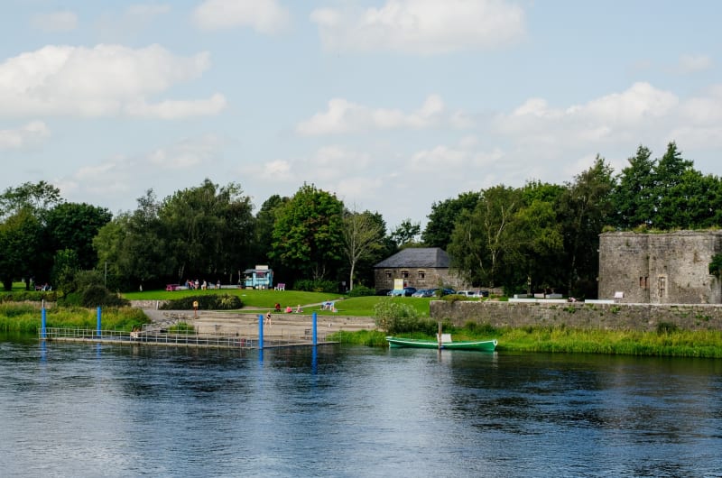 River bank with boat and old stone buildings eadczn