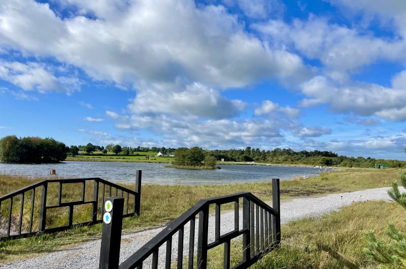 Scenic Lake View With Gravel Path And Railings ue0j7z