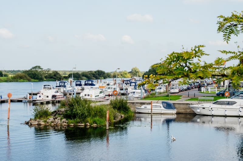 Scenic Marina With White Motorboats On River zu6xlq