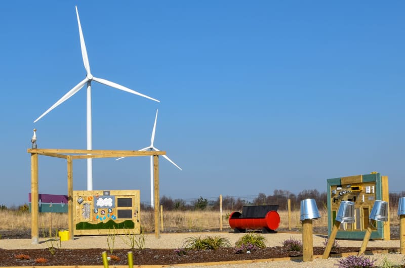 Sensory garden with play equipment and wind turbines