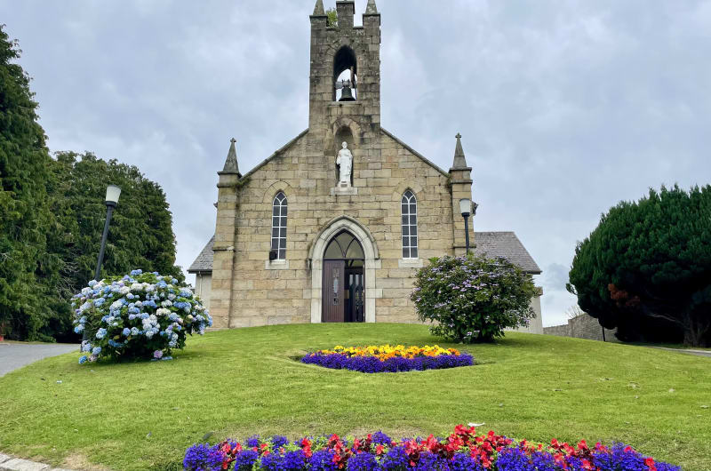 Stone Church With Bell Tower And Flower Beds xgcx7m