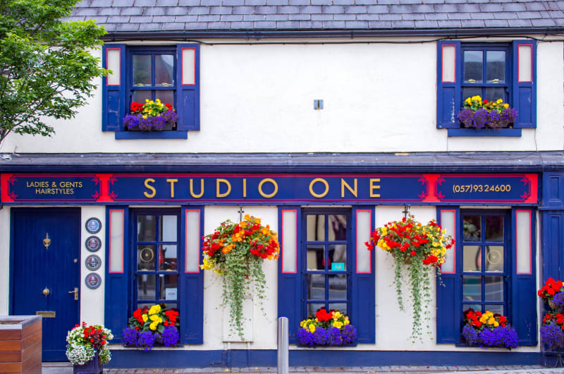 Studio One hair salon storefront with flower boxes po14pj