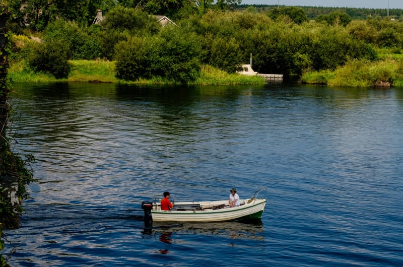 Two Men In Motorboat On Scenic Green River thwthk
