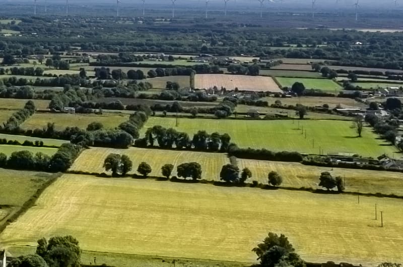 Wide View Of Rural Patchwork Fields Under Sky