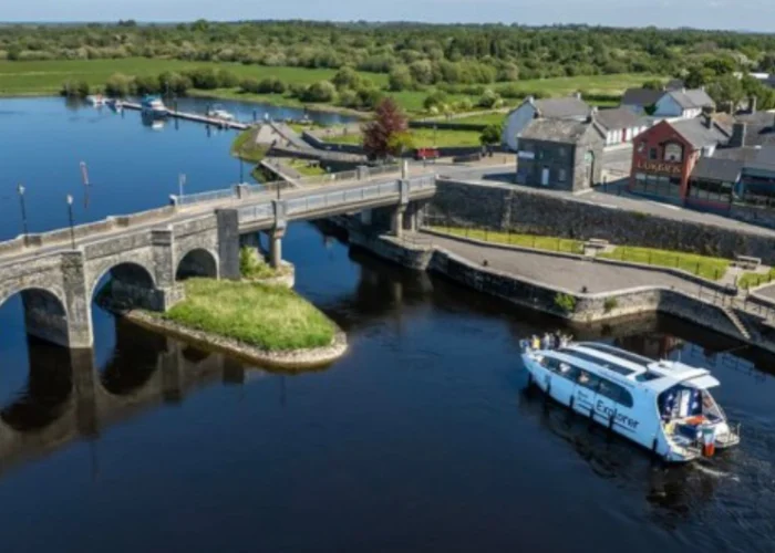 boat going under bridge