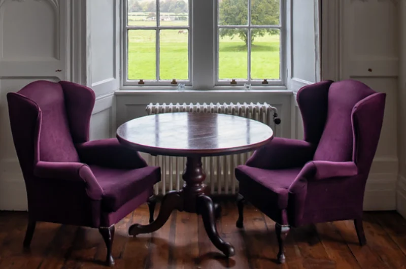 chairs and table by window