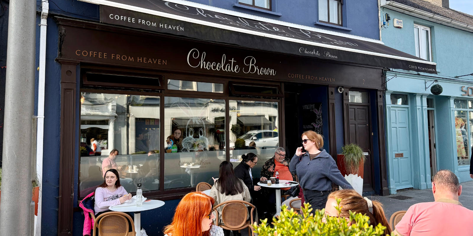 chocolate brown frontage people sitting at tables header