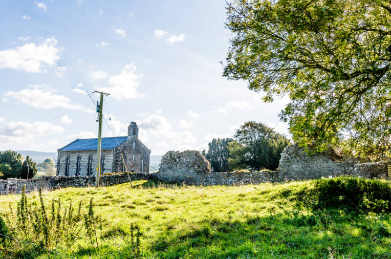 sier church in field blue sky