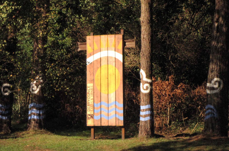 sign and painted trees