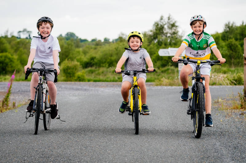 three children on bikes