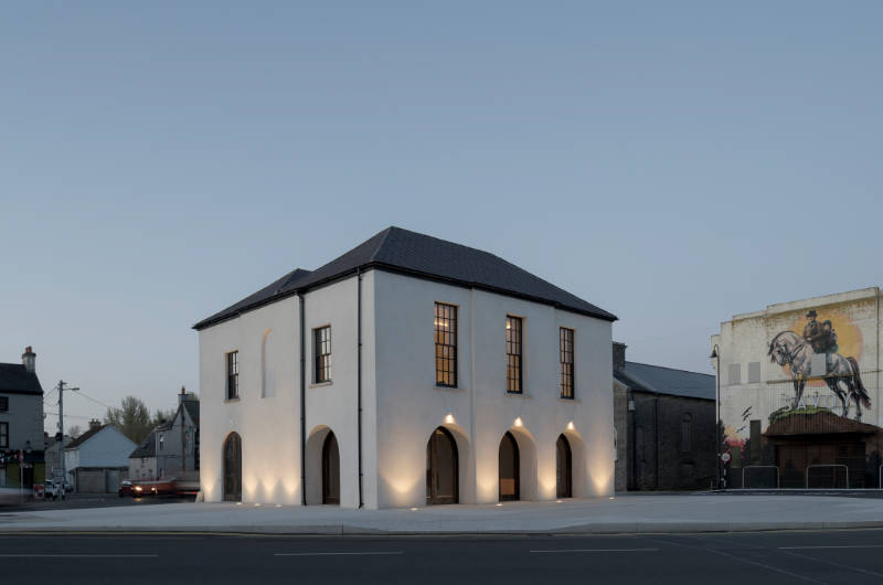 white building with dark roof