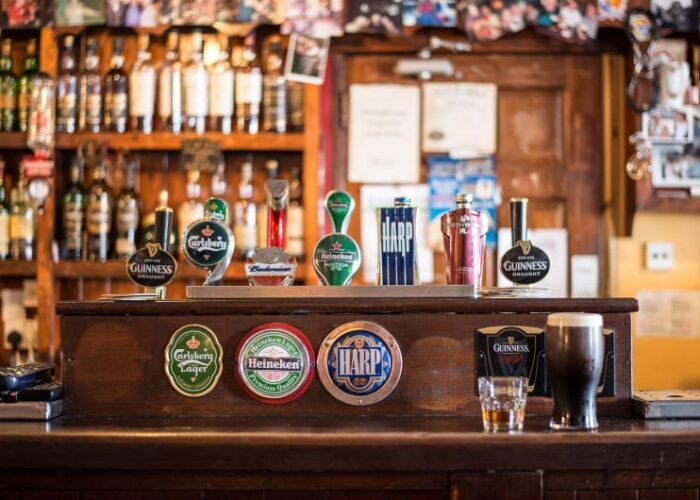 Beer taps on counter in a traditional pub