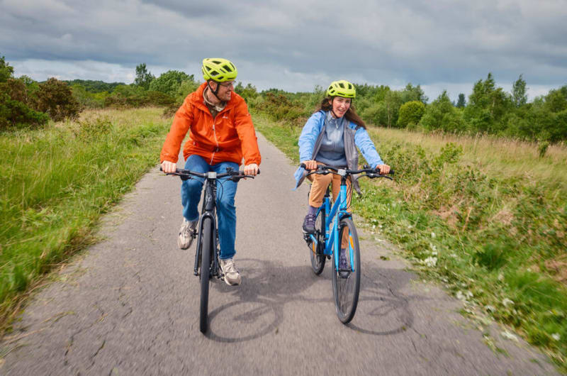 Couple cycling at Lough Boora Discovery Park caha9b