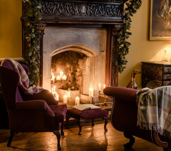Cozy Lounge With Fireplace Candles And Velvet Chairs