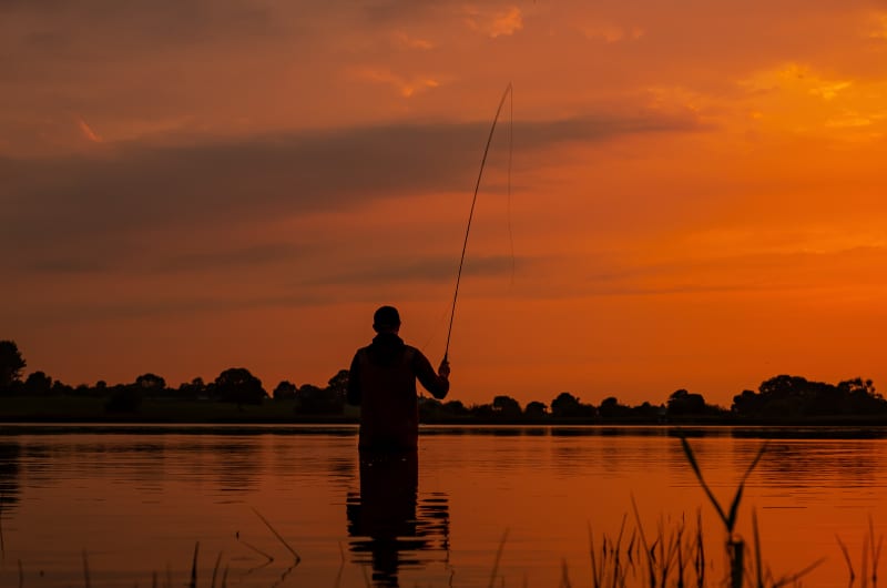 Fisherman Silhouette At Sunset In Water iopdfm
