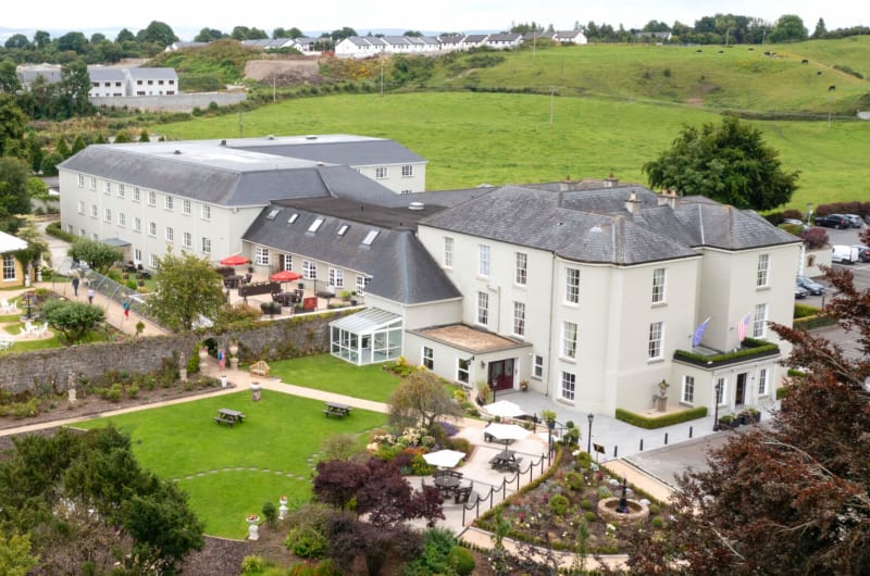 High angle view of County Arms Hotel and gardens