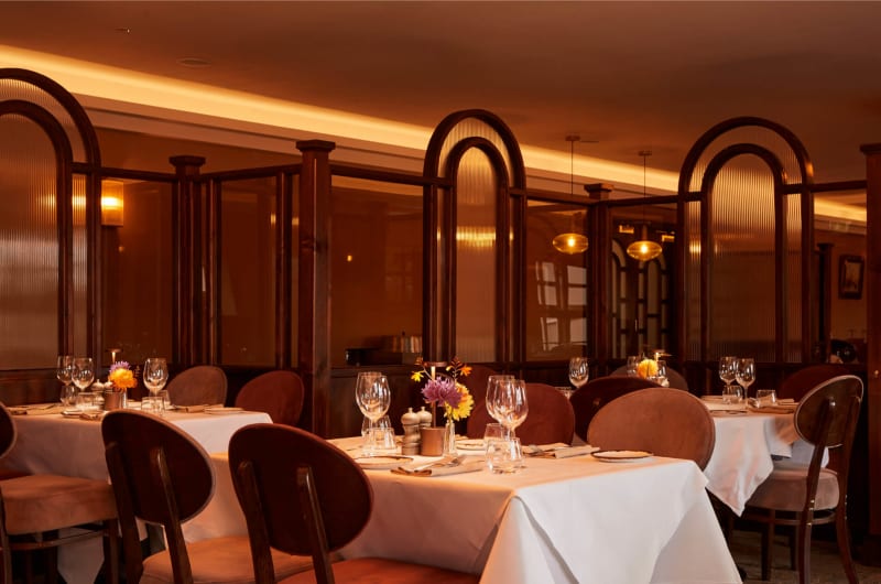Restaurant Interior With Set Tables And Arched Dividers