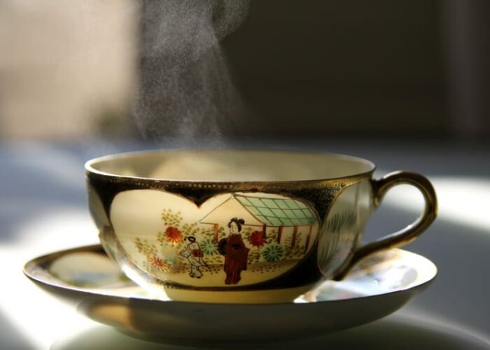Steaming Japanese Teacup With Illustration And Gold Trim