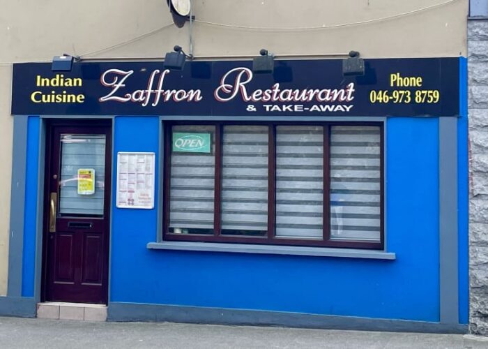 Storefront of Zaffron Indian Restaurant with blue walls