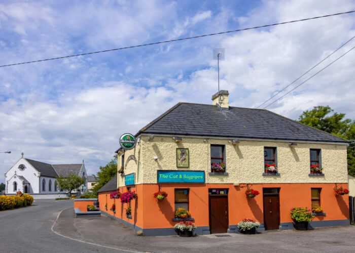 The Cat And Bagpipes Pub With Flower Boxes