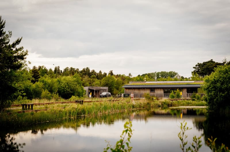 Wooden building beside a lake at Lough Boora