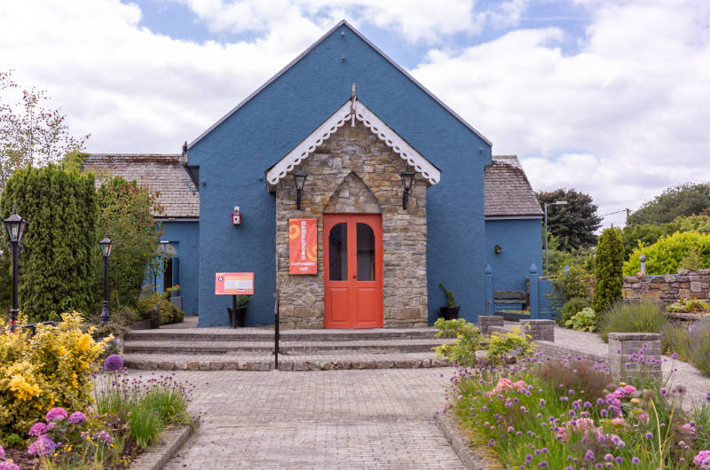 blue building with orange door