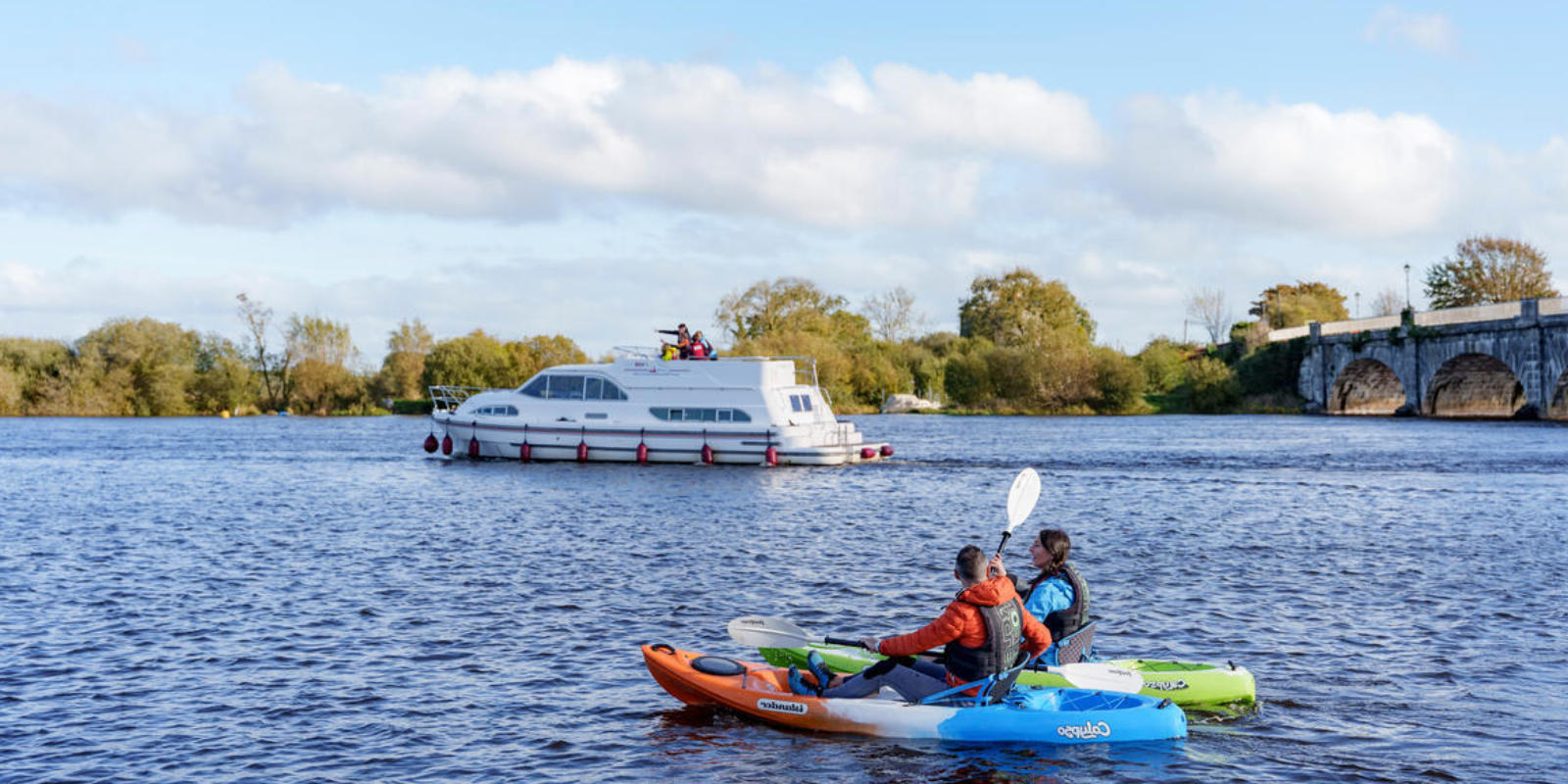 canoes and boat on river