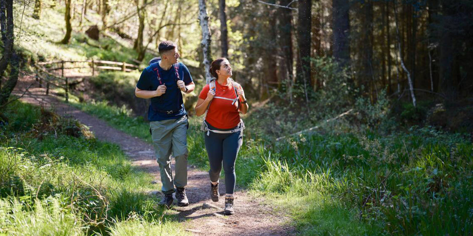 couple hiking through woods