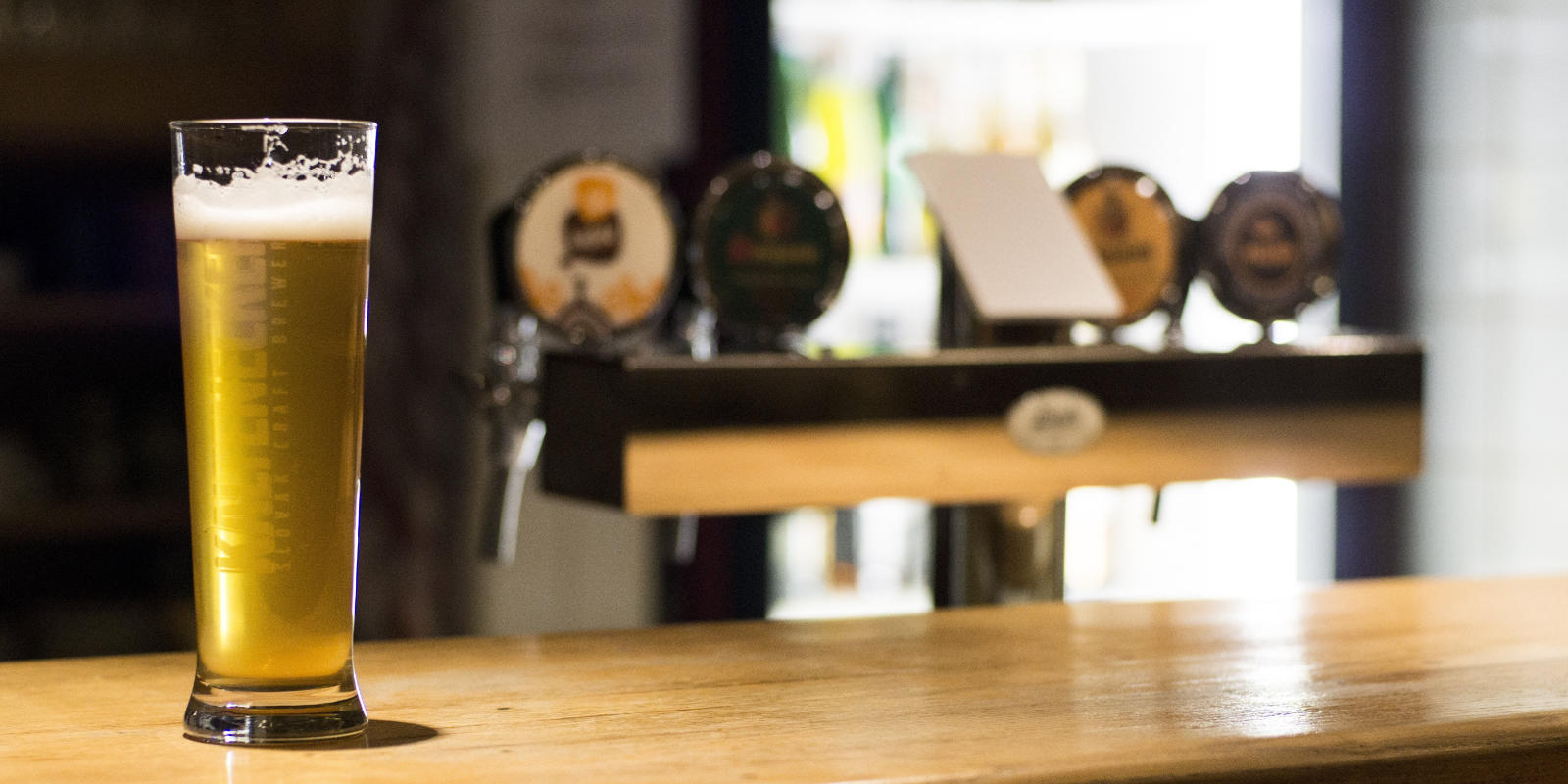 glass of beer on bar header