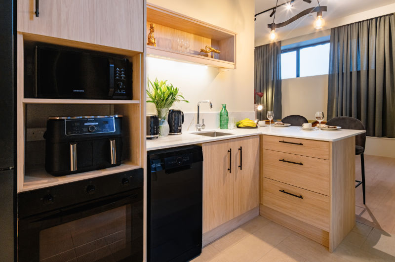 kitchen area will light wood drawers