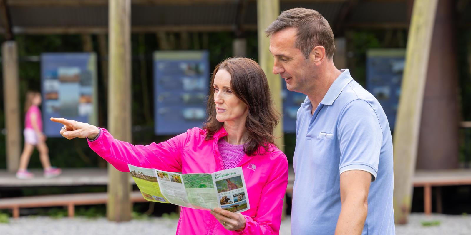 man and woman reading map